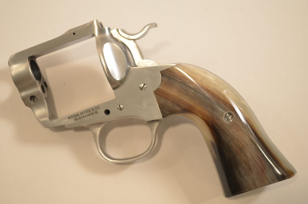 (2) Bighorn on a Ruger Bisley showing black, off-white, and red/brown colors.