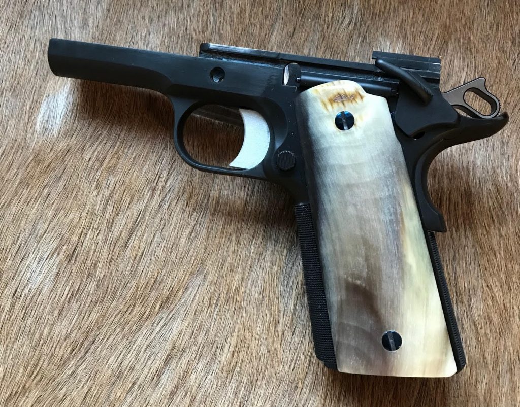 (2) A Colt 1911 by Ted Yost with Bighorn