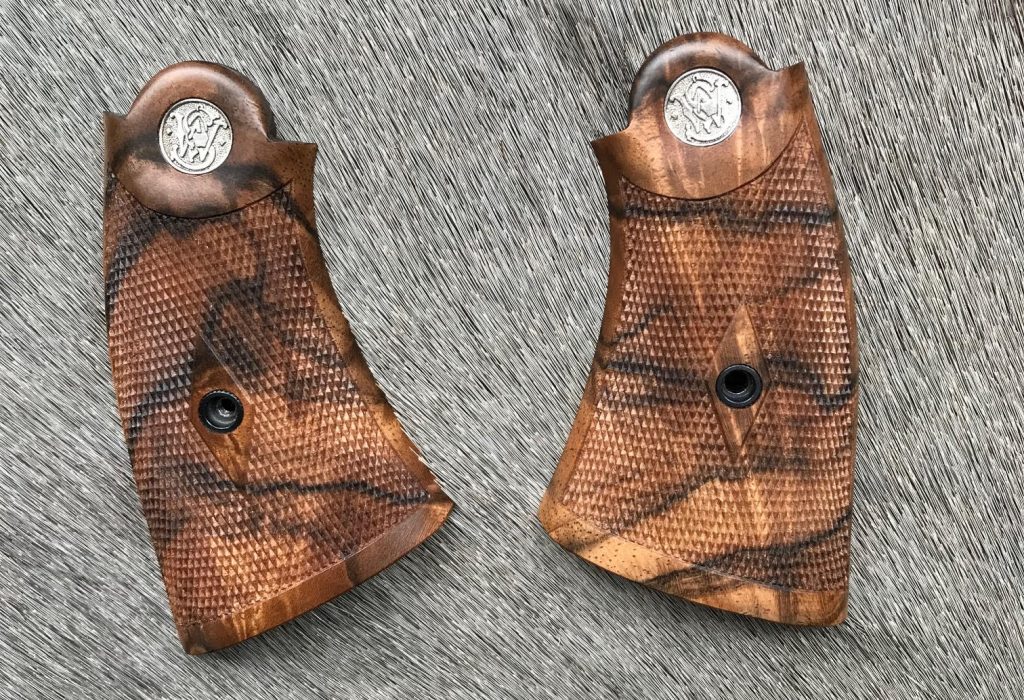 (5) French walnut stocks for a very early S&W hand ejector. 24 LPI checkering in a nice diamond pattern with medallions.